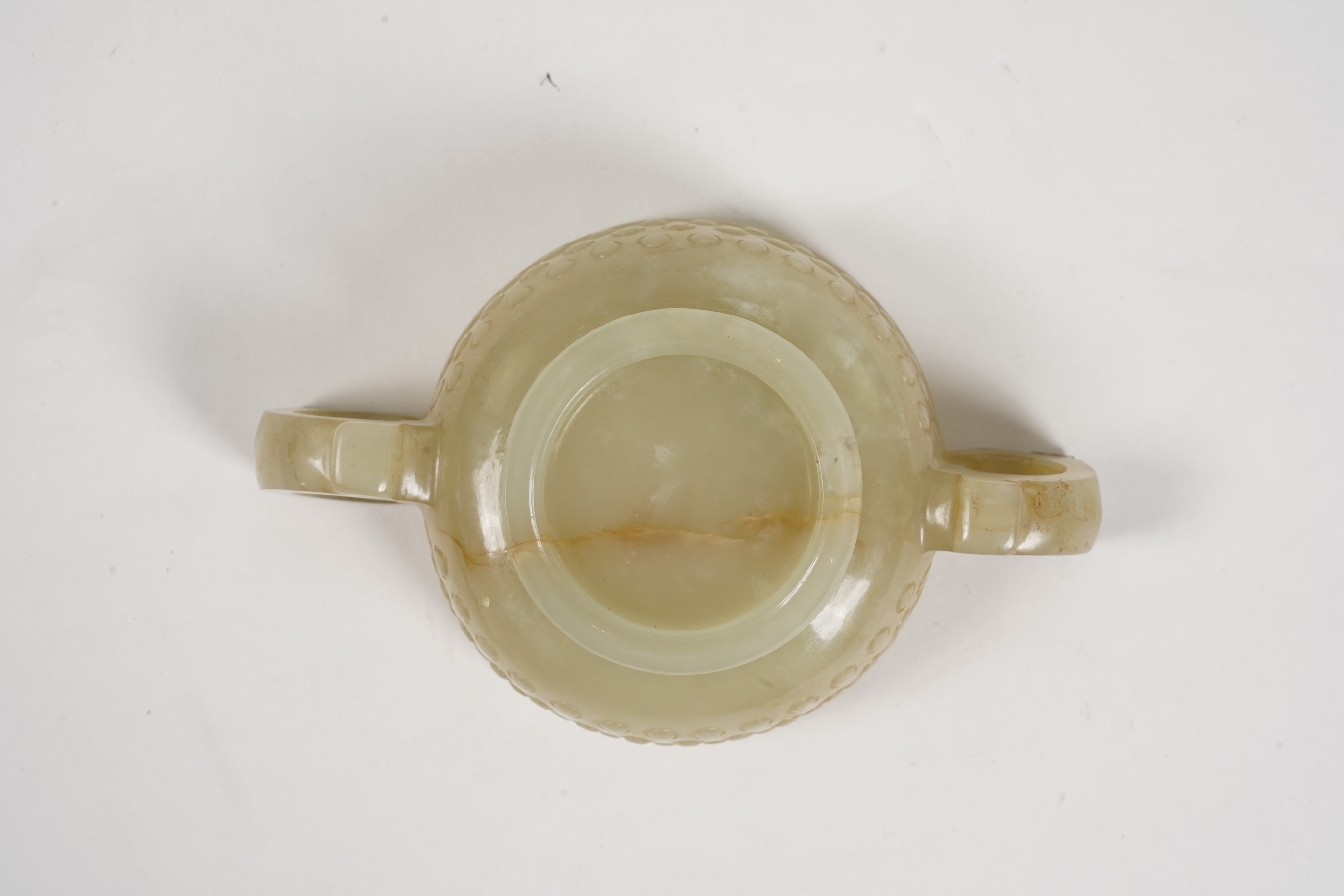 A Chinese pale celadon and russet veined jade cup, 17th century